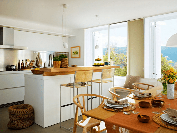 This cozy kitchen features three areas, a kitchen, a mini bar and a dining space
