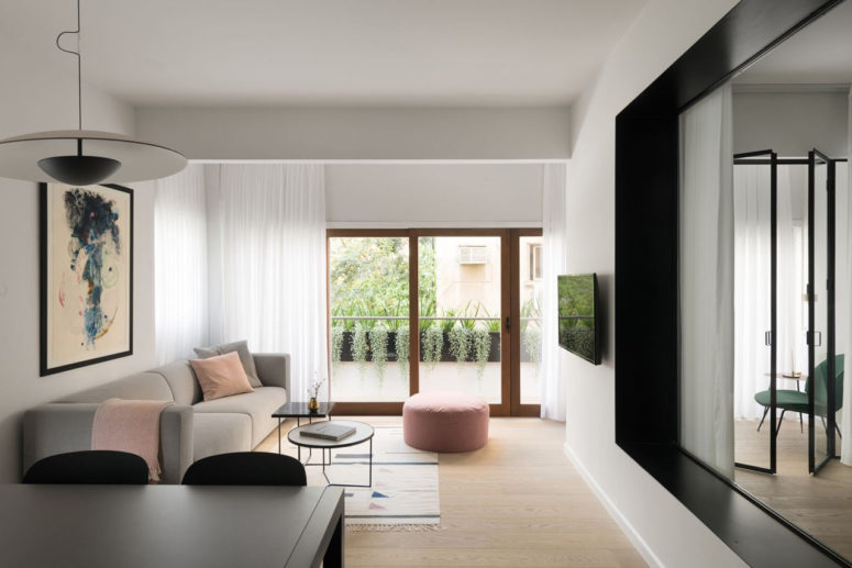 This modern apartment was created for a young family with two children, it's full of muted shades and simple and modern furniture