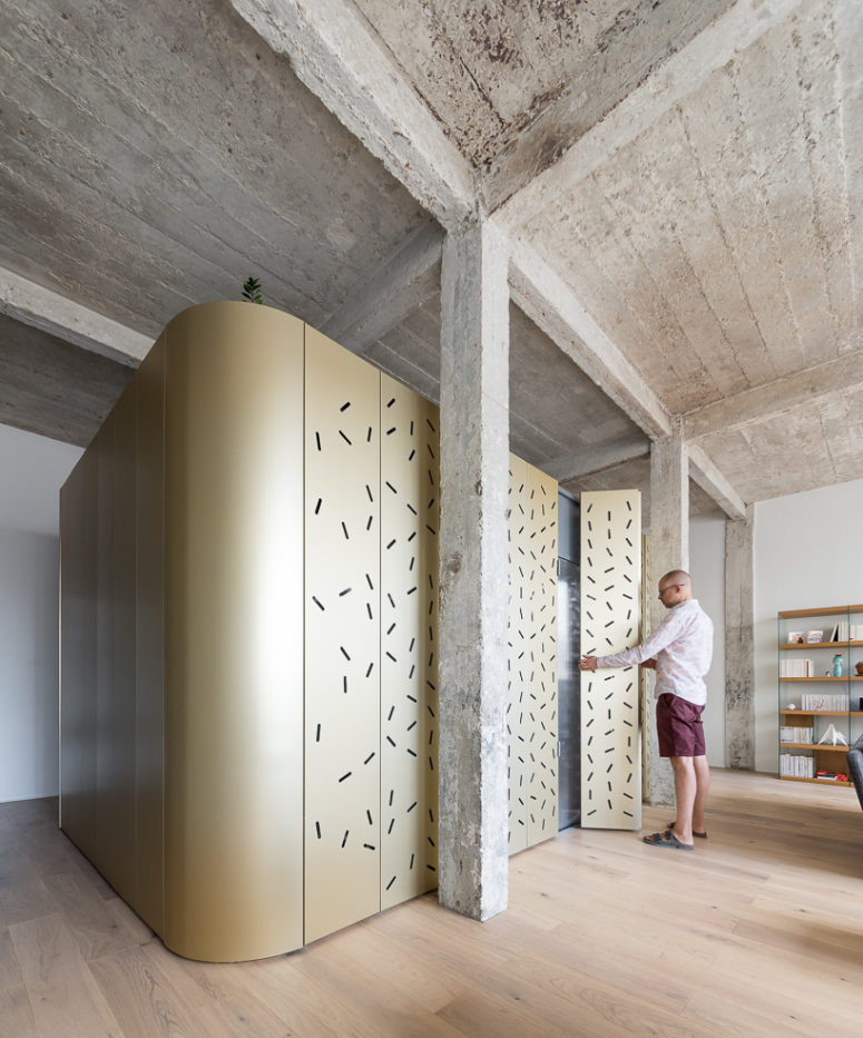 The designers added industrial chic with a concrete ceiling and pillars and perforated panels bring much light in The designers added industrial chic with a concrete ceiling and pillars and perforated panels bring much light in