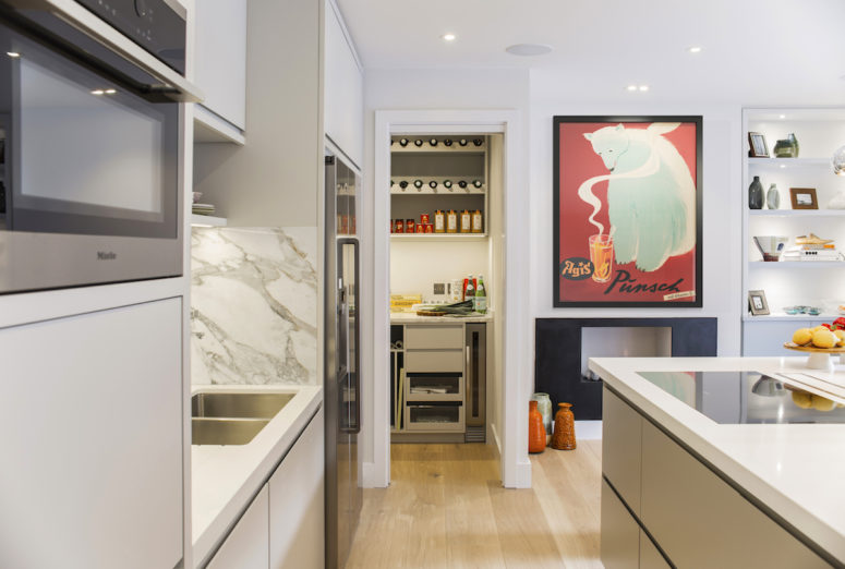 The kitchen was moved to another floor and it features much functional storage