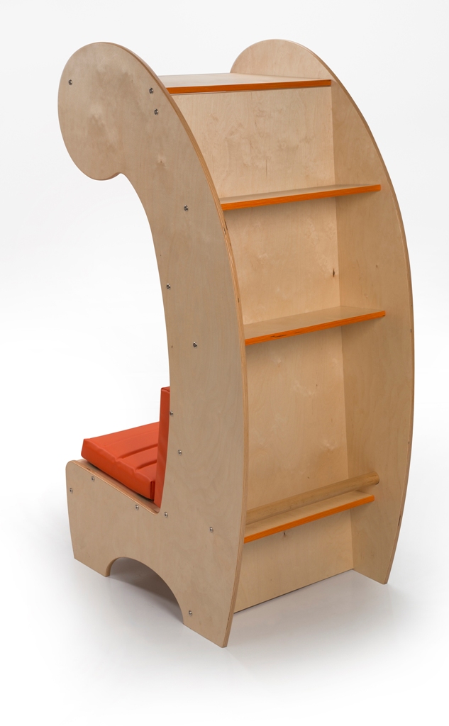 The piece features not only a comfy and colorful seat but also some bookshelves on the back of it