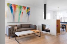 cool fireplace that acts as a space divider