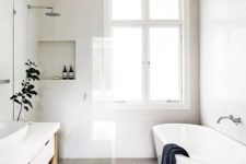 04 a clean minimalist bathroom with natural wood and jute touches and a grey tile floor