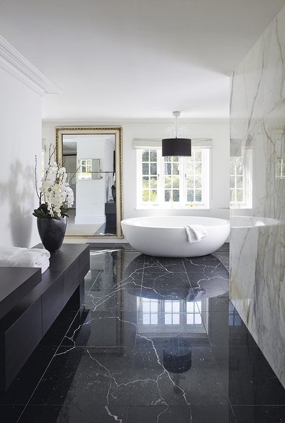 marble is a glam and luxurious material, so using it for decor is a great idea, and add a large mirror
