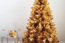 08 a gold pre-lit Christmas tree doesn’t require any ornaments or decorations as it’s bold itself