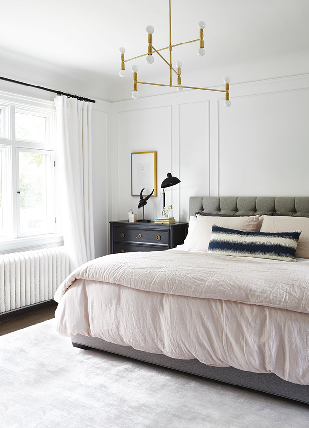 The master bedroom is done in neutrals plus grey, and there are some metallic touches for a chic look The master bedroom is done in neutrals plus grey, and there are some metallic touches for a chic look