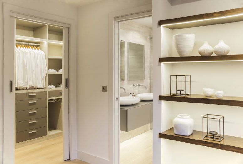 The master suite has been restructured to include a dressing room extension adjacent to the bathroom