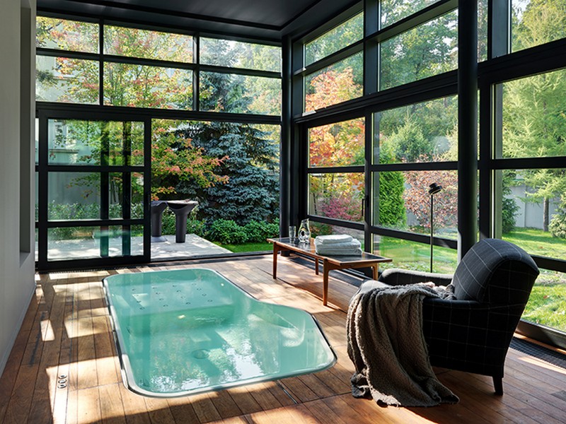 There's a cool bath space with framed glass walls and a jacuzzi, which can be opened to outdoors