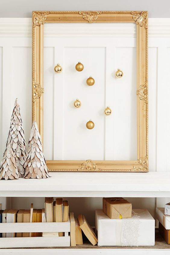a vintage gold frame with gold ornaments hanging inside is a great decoration to make