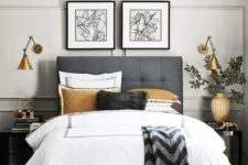 09 industrial brass sconces with an asymmetric shade add a cool touch to the bedroom