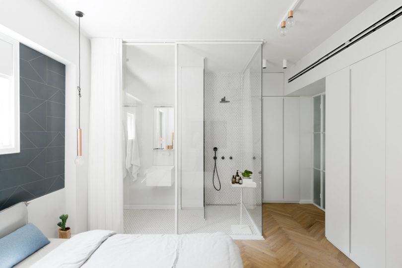 The master bedroom features a shower space integrated right into the room