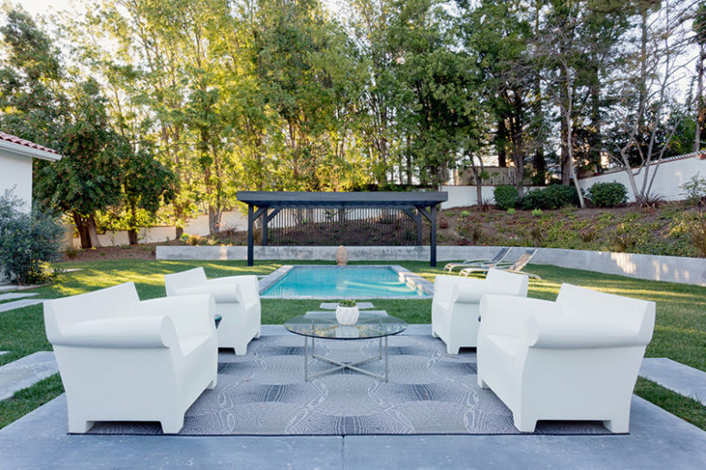 There's a terrace, a swimming pool and some comfy chairs