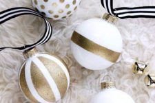 11 a gold glitter and white ornaments with various prints