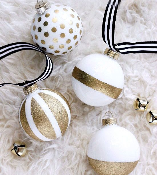 a gold glitter and white ornaments with various prints