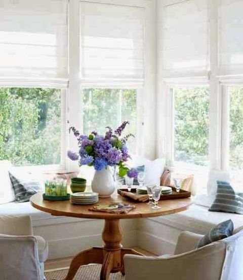 a round pedestal table is a great fir for any breakfast space, and it won't take much of it