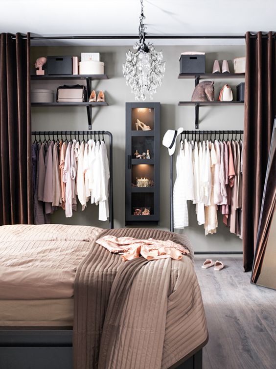 hide your closet in the bedroom behind curtains and make it invisible whenever you want