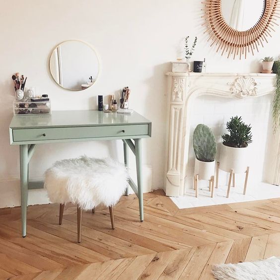 a simple round mirror looks nice over a green vanity