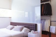 17 a frosted glass headboard wall hides the closet and looks ethereal at the same time