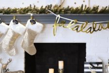 17 a fun glam mantel with a lit up fir garland, polka dot signs, shiny stockings, metallic decor and a sparkling deer