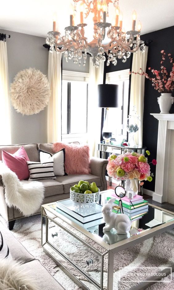 faux fur, crystals and a mirrored coffee table for a glam feel in the space