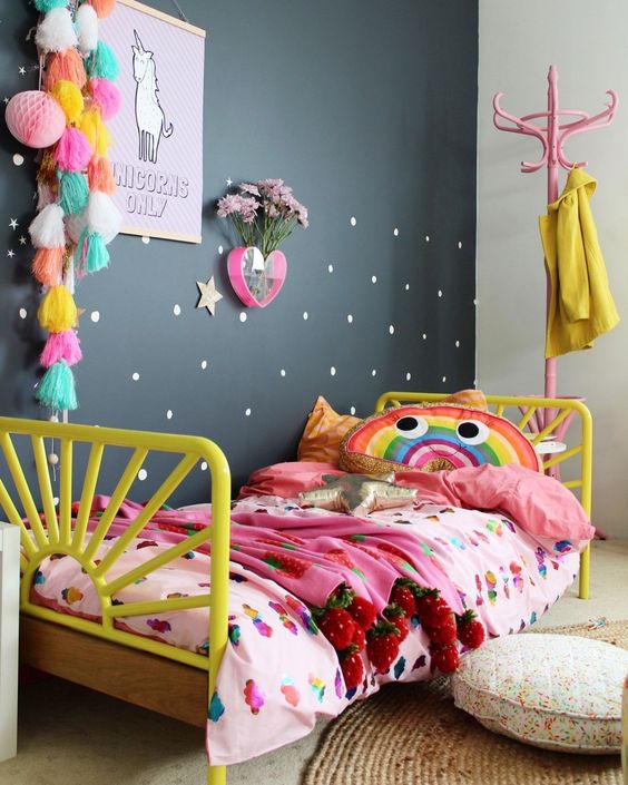 a bold and colorful girl's room with a single black wall to look calmer