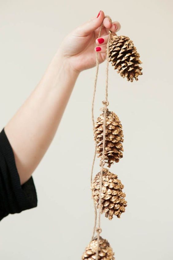 a gold pinecone garland is great for rustic and glam Christmas decor