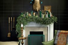 20 a lush evergreen garland and lots of candles in the shades of green and gold make an edgy look