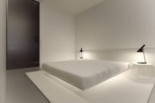 20 a very clean minimal bedroom with a floating bed and additional lighting under it