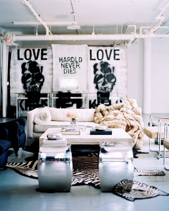 a glam space with touches of Gothic added in artworks on the wall