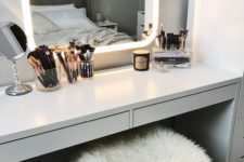 21 a mirror with integrated lights in the frame is a super functional and modern idea