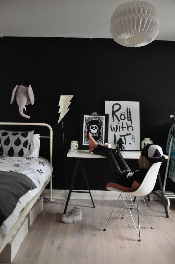 a stylish black and white space for a little rock-n-roller should be done with a black wall, of course