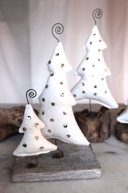 simple white felt Christmas trees with silver sequins and metal stands for modern Christmas decor