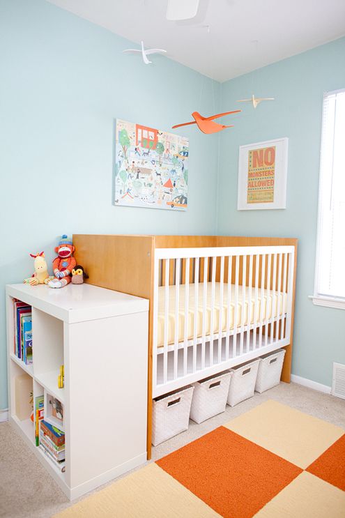 storage cubbies under the crib and a dresser next to it for much storage