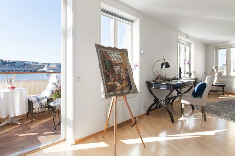 This gorgeous Swedish apartment features not only Scandinavian touches but also river inspired blue details