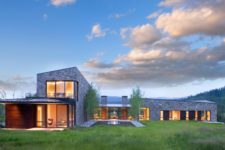 01 This large Wyoming residence is clad with stone and wood features amazing views of the beautiful nature around