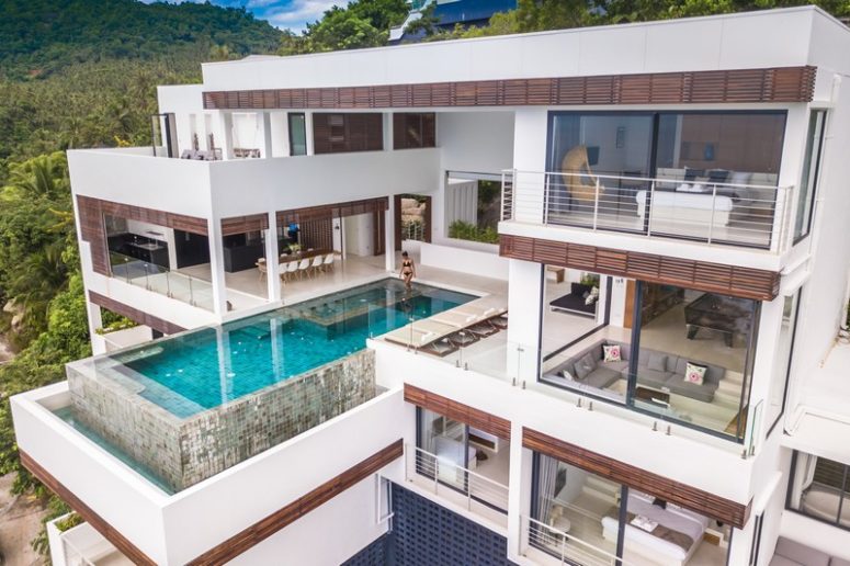 This modern waterfront villa is built on a rock, with horizontal geometry and with gorgeous sea views