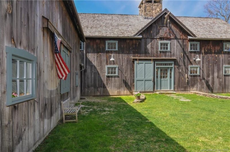 This unique home is made of two old barns transported to the property