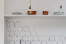 02 The dove grey cabinets are made more eye-catchy with white marble countertops and a white hex tile backsplash