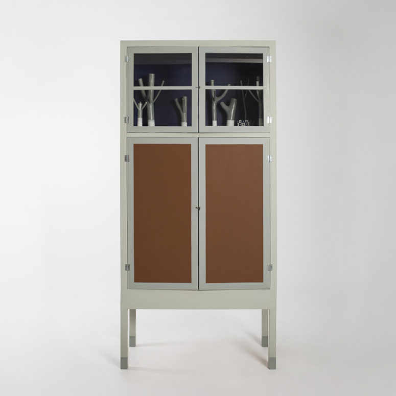 The piece is made of enamel, acrylic, wood, glass and plastic and it's not very large