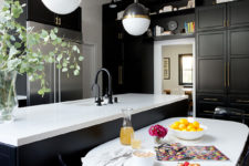 02 The small dining space is done with a white table and acrylic chairs for an edgy modern feel