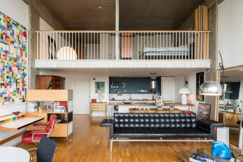 There are two levels, the upper is with private spaces, and the lower one is an open plan space with a kitchen, dining and living room