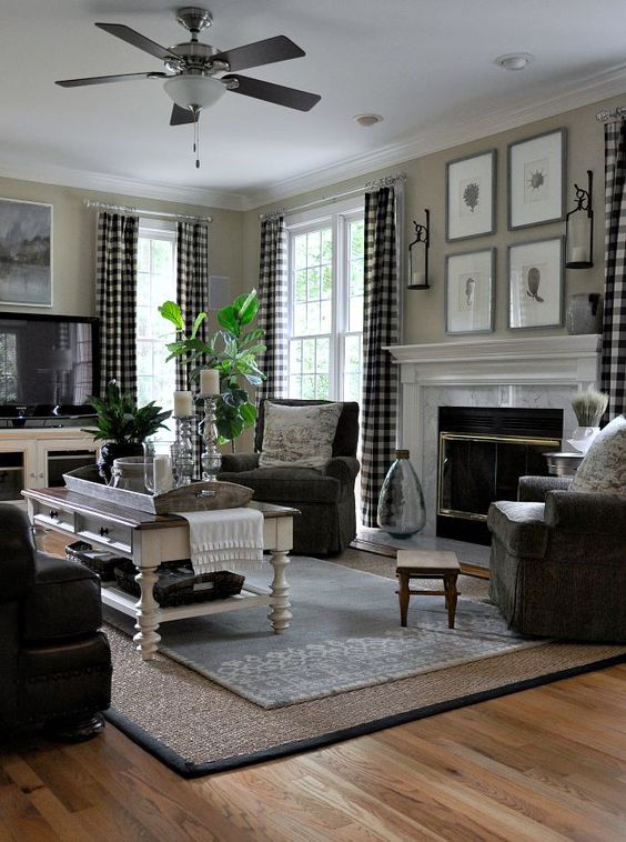 a barn-inspired living room with buffalo check curtains that add rustic chic