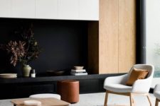 02 a contrasting living room with light-colored wood, black and white furniture