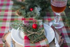 02 a plaid tablecloth, plaid napkins and evergreens with berries for a cozy rustic tablescape