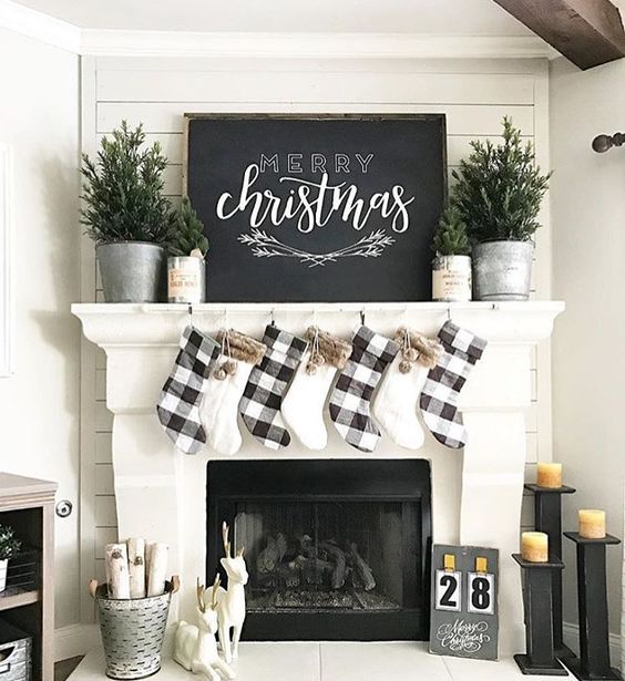 black and white is an ideal color combo for farmhouse Christmas decor, checked stockings and no decor trees
