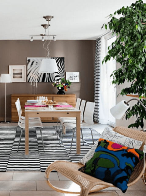One wall is brown to mark the dining space and make the room look not so narrow