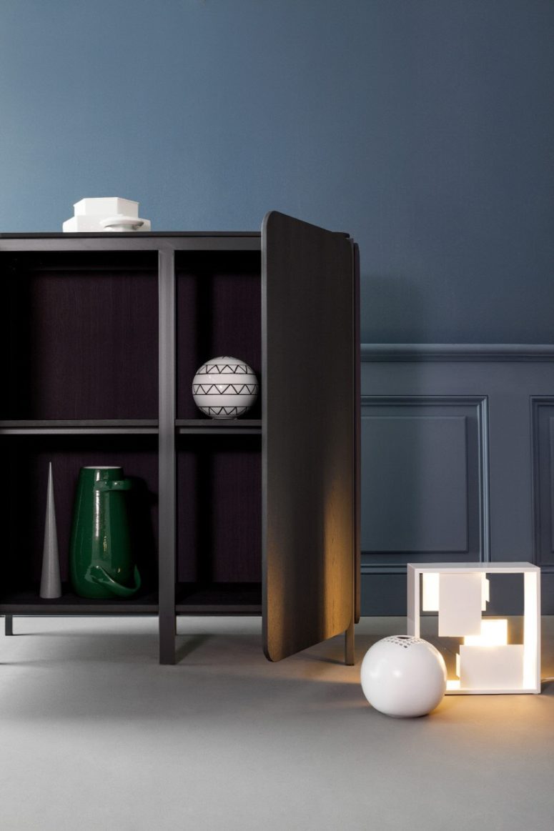 dark sideboard with rounded corners The inside of the sideboard is also contrasting to make the sideboards non-traditional