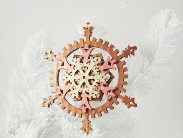 a colorful felt gear snowflake ornament for Christmas