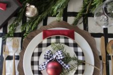 04 a plaid plate and a wooden charger can make up a cool setup for Christmas