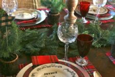 04 plaid mats and plates, an evergreen garland, deer candles, red glasses for a traditional feel